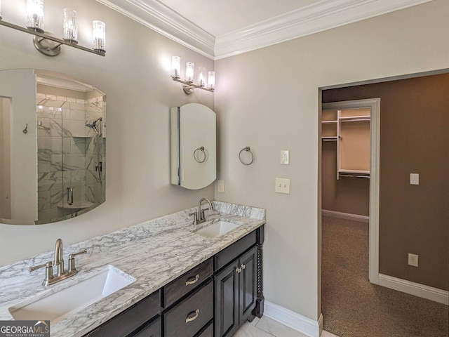 full bath featuring a shower stall, crown molding, a sink, and baseboards