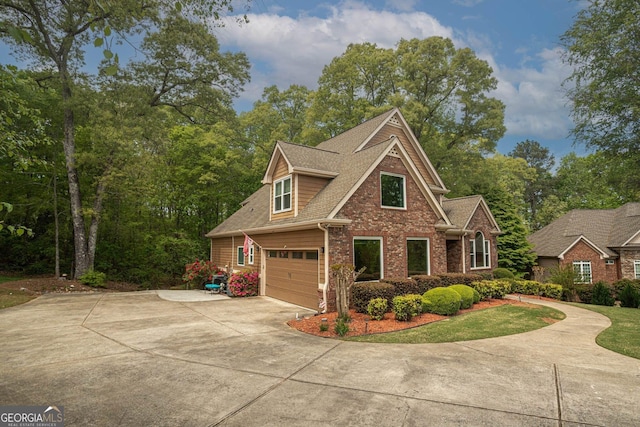 view of front of property featuring an attached garage, roof with shingles, concrete driveway, and brick siding