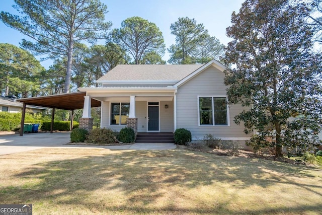 215 Chapman Pl, Athens, GA 30606 - view of front facade featuring concrete driveway, an attached carport, covered porch, and a front yard