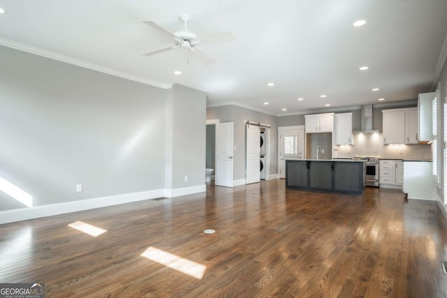 215 Chapman Pl, Athens, GA 30606 - unfurnished living room featuring stacked washer / drying machine, ornamental molding, recessed lighting, dark wood-style flooring, and a ceiling fan