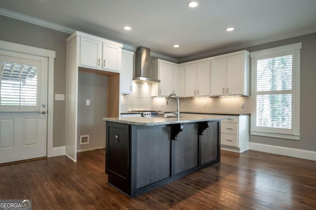 215 Chapman Pl, Athens, GA 30606 - kitchen featuring wall chimney range hood, white cabinetry, decorative backsplash, crown molding, and recessed lighting