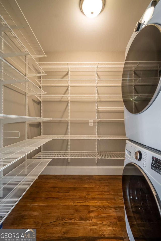 215 Chapman Pl, Athens, GA 30606 - laundry area featuring stacked washer / dryer and wood finished floors