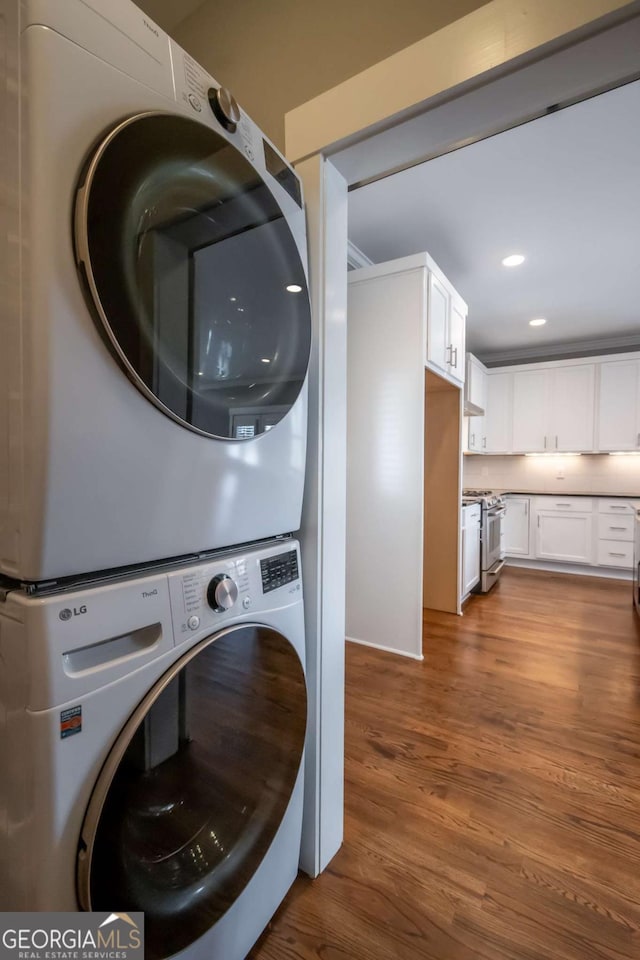 215 Chapman Pl, Athens, GA 30606 - washroom with stacked washer / drying machine, wood finished floors, and recessed lighting