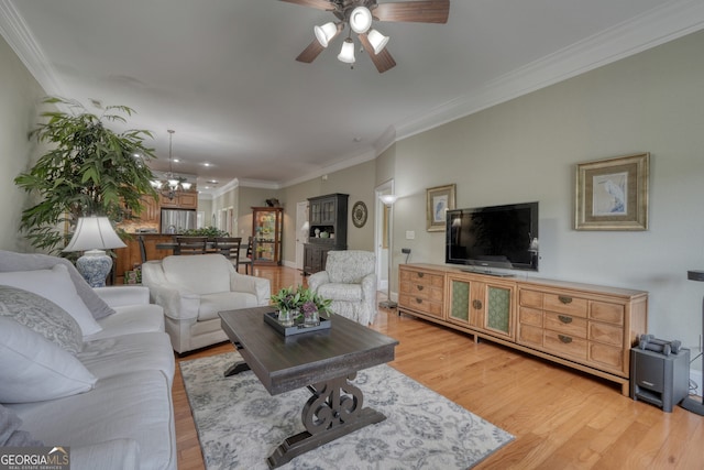 1649-H Lakeview Dr, Young Harris, GA 30582 - living area featuring light wood-type flooring, ornamental molding, ceiling fan, and a chandelier