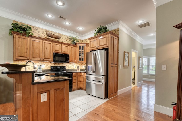 1649-H Lakeview Dr, Young Harris, GA 30582 - kitchen featuring black appliances, a peninsula, a sink, crown molding, and decorative backsplash