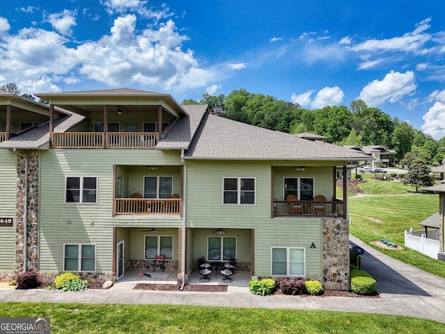 1649-H Lakeview Dr, Young Harris, GA 30582 - back of house with a balcony, ceiling fan, and a lawn