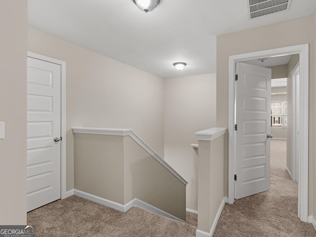 1064 Lear Dr, Locust Grove, GA 30248 - hallway featuring an upstairs landing and carpet floors