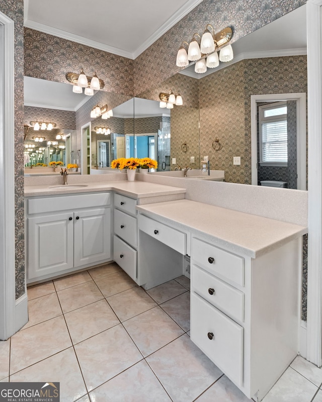 bathroom with crown molding, wallpapered walls, tile patterned floors, vanity, and an inviting chandelier