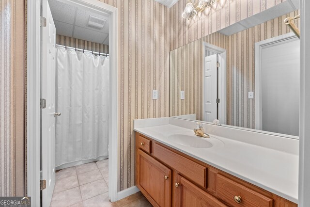bathroom with visible vents, wallpapered walls, tile patterned floors, and vanity
