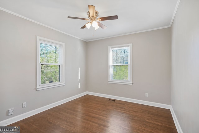 1013 Columbia Dr, Decatur, GA 30030 - unfurnished room with dark wood finished floors, crown molding, and ceiling fan