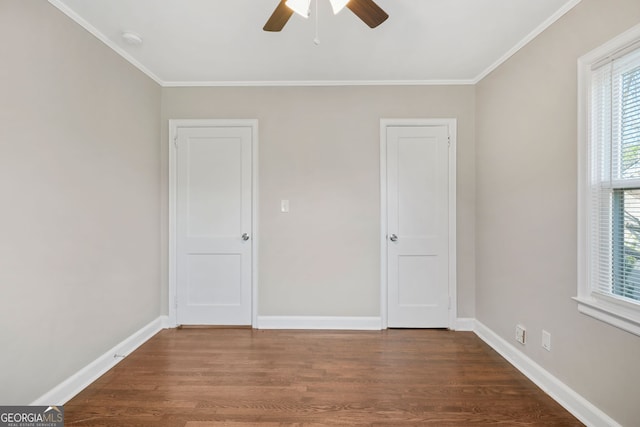 1013 Columbia Dr, Decatur, GA 30030 - spare room featuring ceiling fan, dark wood-style floors, a smoke detector, and ornamental molding