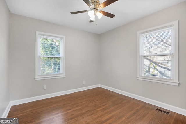 1013 Columbia Dr, Decatur, GA 30030 - empty room featuring dark wood-style flooring and a ceiling fan