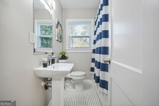1013 Columbia Dr, Decatur, GA 30030 - bathroom with a shower with curtain and tile patterned floors