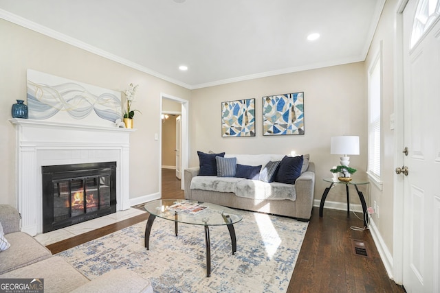 1013 Columbia Dr, Decatur, GA 30030 - living area featuring wood-type flooring, ornamental molding, a fireplace with flush hearth, and recessed lighting