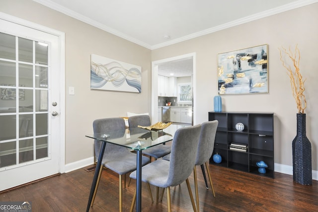 1013 Columbia Dr, Decatur, GA 30030 - dining room with dark wood-type flooring and crown molding