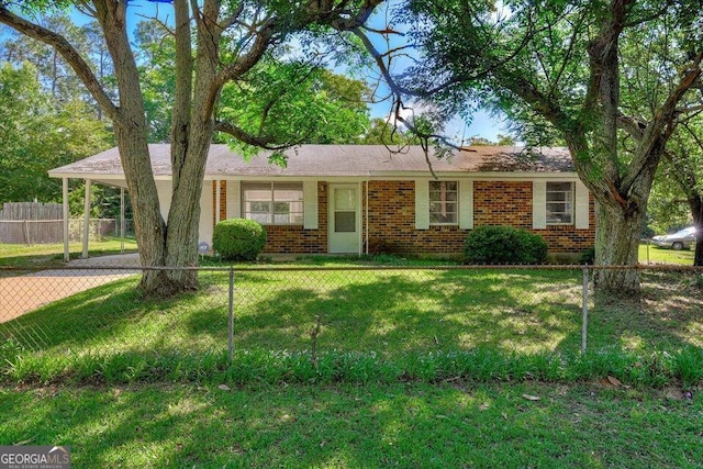 2352 Helsinki Dr, Augusta, GA 30906 - ranch-style home featuring driveway, a front yard, fence, brick siding, and a carport