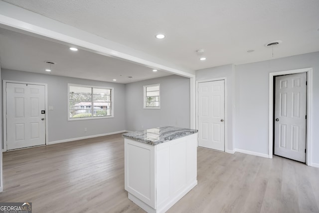 2352 Helsinki Dr, Augusta, GA 30906 - kitchen with baseboards, light wood-type flooring, and light stone counters
