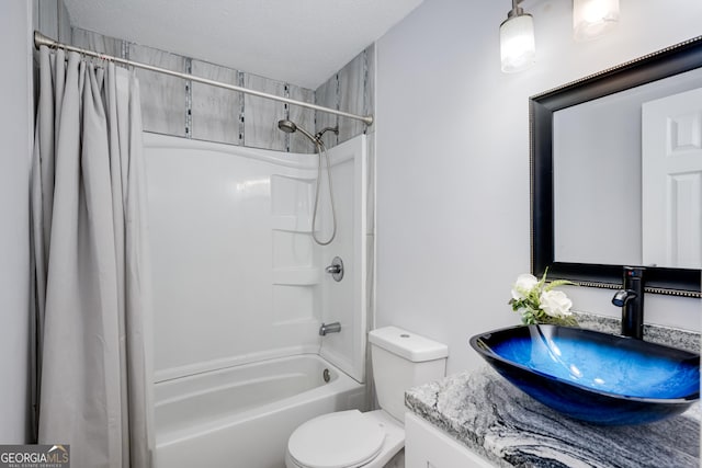 2352 Helsinki Dr, Augusta, GA 30906 - full bathroom with a textured ceiling, toilet, vanity, and shower / bath combo with shower curtain