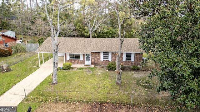 2352 Helsinki Dr, Augusta, GA 30906 - single story home with driveway, a fenced front yard, a front yard, brick siding, and an attached carport
