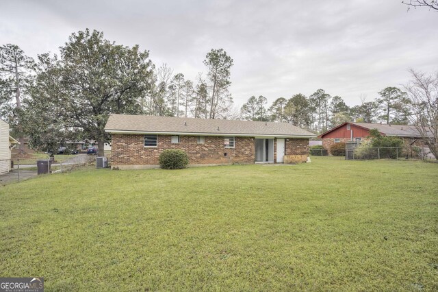 2352 Helsinki Dr, Augusta, GA 30906 - back of property with brick siding, fence, and a yard