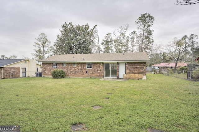 2352 Helsinki Dr, Augusta, GA 30906 - rear view of house with brick siding, fence, central air condition unit, and a yard