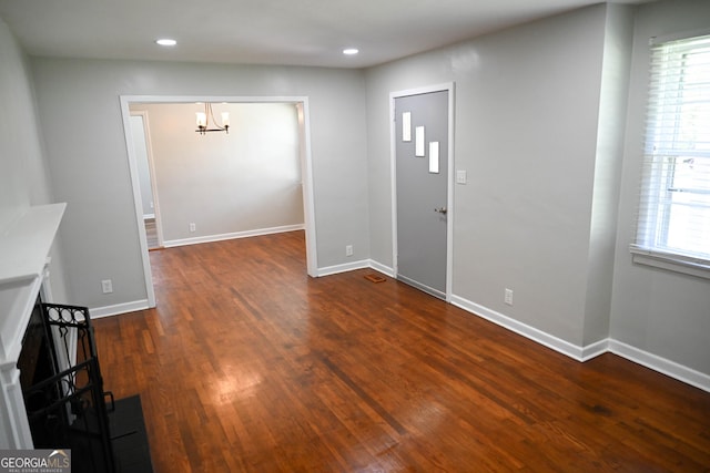 foyer featuring recessed lighting, a notable chandelier, baseboards, and wood finished floors