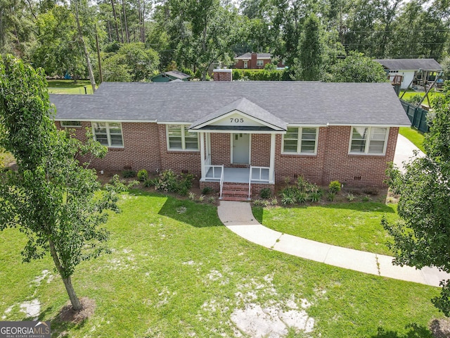 ranch-style house featuring covered porch, brick siding, a front lawn, and crawl space