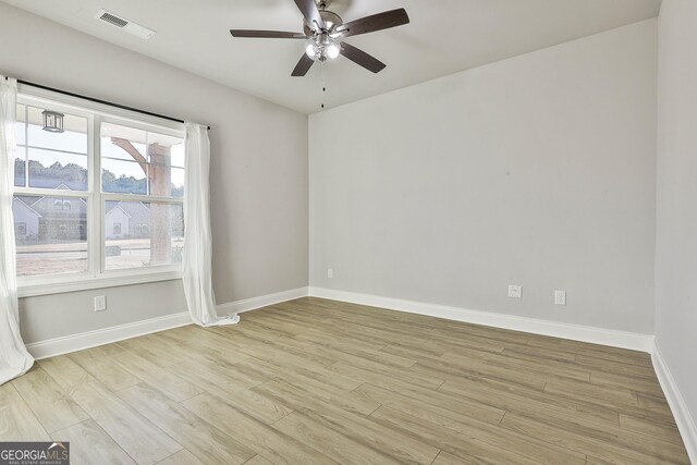 8 Sumner Way, Senoia, GA 30276 - unfurnished room featuring light wood-style floors, baseboards, ceiling fan, and visible vents