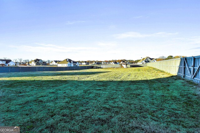 8 Sumner Way, Senoia, GA 30276 - view of yard with a fenced backyard and a residential view