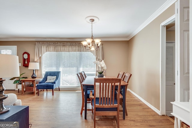 2926 Westbury Dr, Decatur, GA 30033 - dining area with baseboards, crown molding, light wood-style floors, and a notable chandelier
