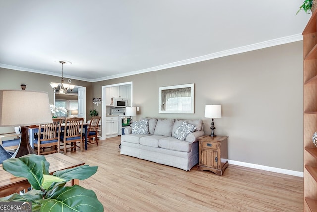 2926 Westbury Dr, Decatur, GA 30033 - living room with baseboards, ornamental molding, light wood-style floors, and a notable chandelier