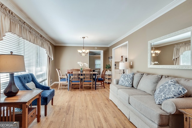 2926 Westbury Dr, Decatur, GA 30033 - living area featuring ornamental molding, baseboards, light wood-style floors, and a chandelier