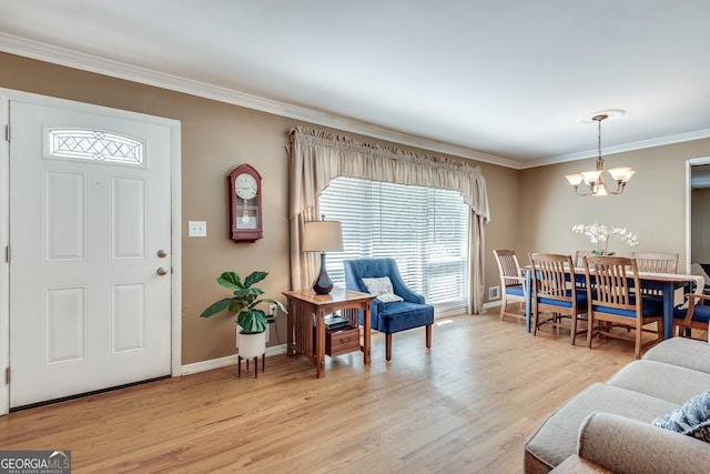 2926 Westbury Dr, Decatur, GA 30033 - entryway with baseboards, light wood-style floors, ornamental molding, and a chandelier