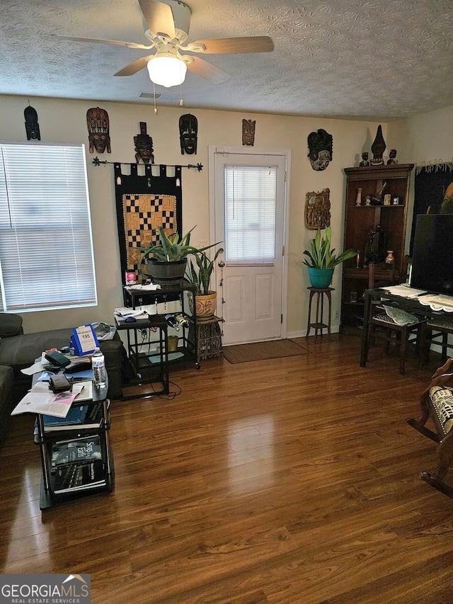315 Saratoga Pl, Riverdale, GA 30296 - living room with wood finished floors, a textured ceiling, and ceiling fan