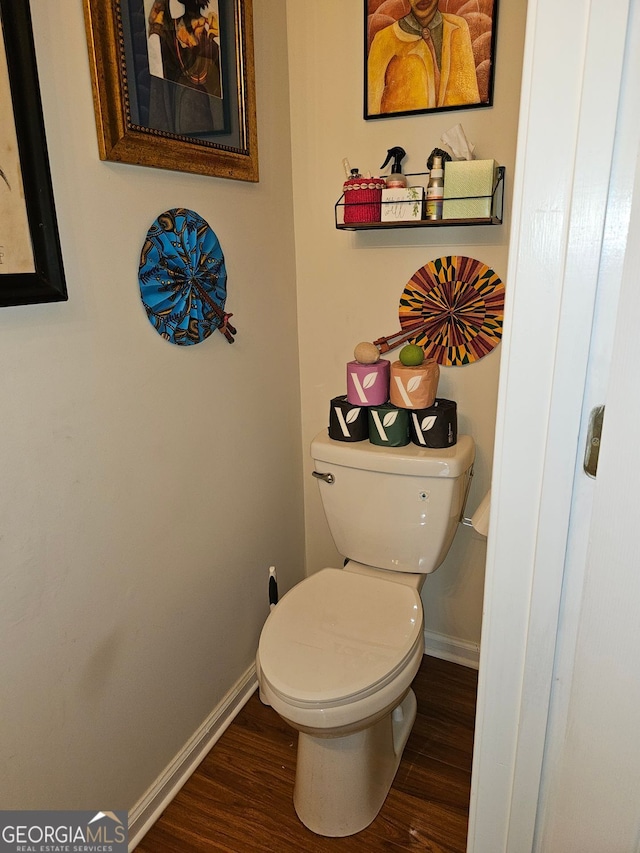 315 Saratoga Pl, Riverdale, GA 30296 - bathroom with baseboards, toilet, and wood finished floors