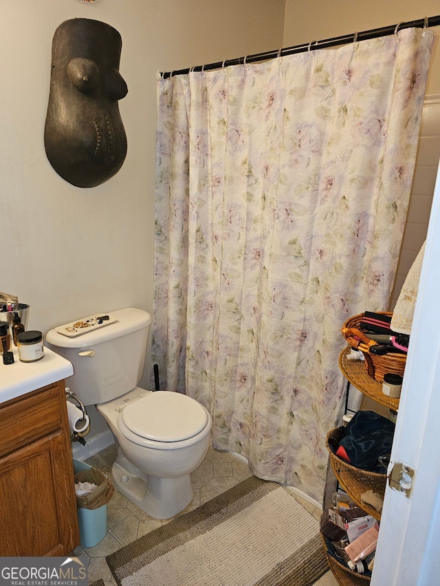 315 Saratoga Pl, Riverdale, GA 30296 - bathroom featuring a shower with shower curtain, toilet, and tile patterned floors