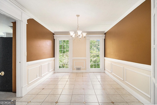 1472 Hartman Dr SW, Lilburn, GA 30047 - unfurnished dining area featuring a decorative wall, a chandelier, wainscoting, ornamental molding, and light tile patterned floors