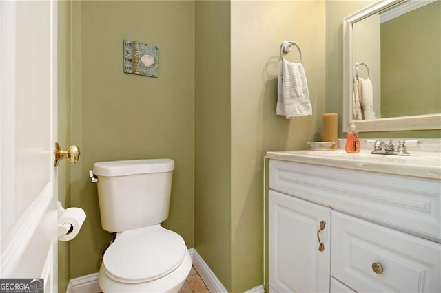 1472 Hartman Dr SW, Lilburn, GA 30047 - half bathroom featuring vanity, toilet, and baseboards
