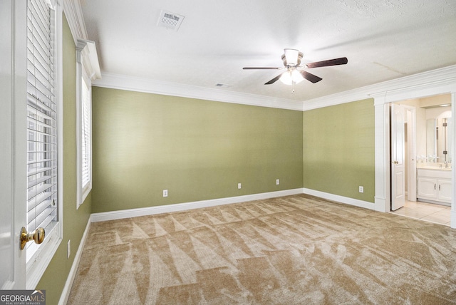 1472 Hartman Dr SW, Lilburn, GA 30047 - unfurnished bedroom with carpet flooring, crown molding, baseboards, ensuite bath, and ceiling fan