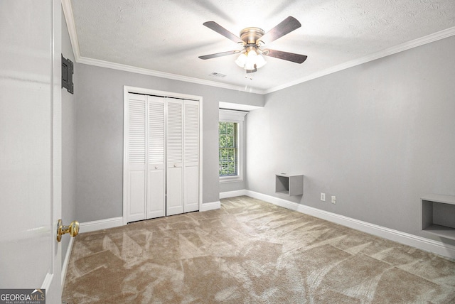 1472 Hartman Dr SW, Lilburn, GA 30047 - unfurnished bedroom featuring carpet flooring, baseboards, crown molding, a textured ceiling, and ceiling fan