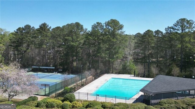 1472 Hartman Dr SW, Lilburn, GA 30047 - community pool featuring a tennis court