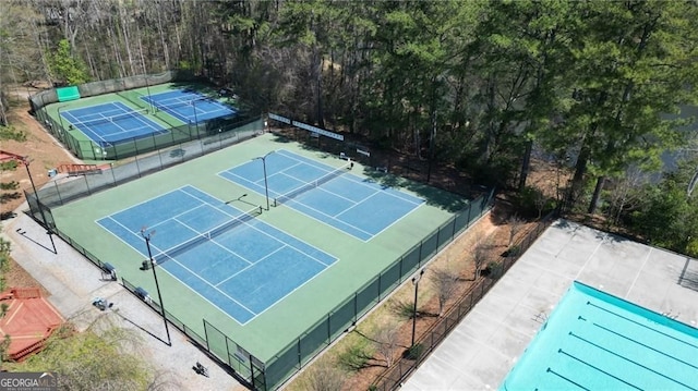 1472 Hartman Dr SW, Lilburn, GA 30047 - view of tennis court featuring a view of trees