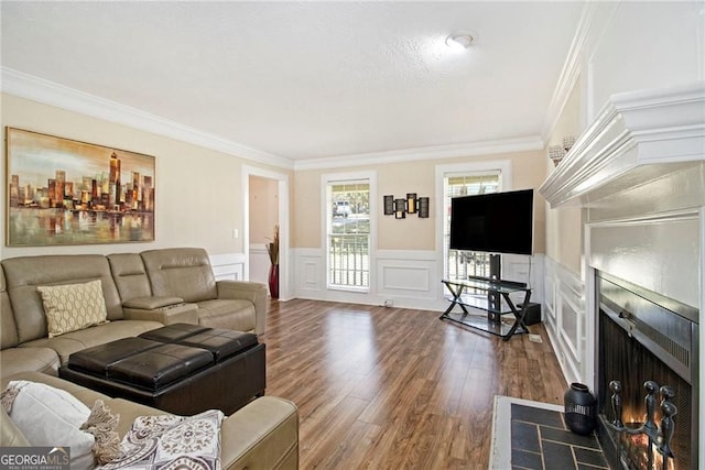 1472 Hartman Dr SW, Lilburn, GA 30047 - living room with ornamental molding, wood finished floors, wainscoting, and a decorative wall