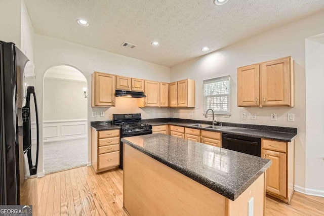 4157 Medlock Woods Dr, Snellville, GA 30039 - kitchen featuring a sink, under cabinet range hood, black appliances, and light brown cabinets