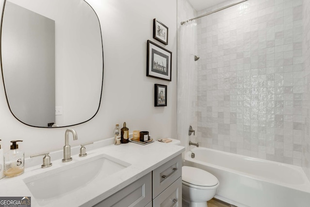 full bathroom featuring  shower combination, toilet, and vanity