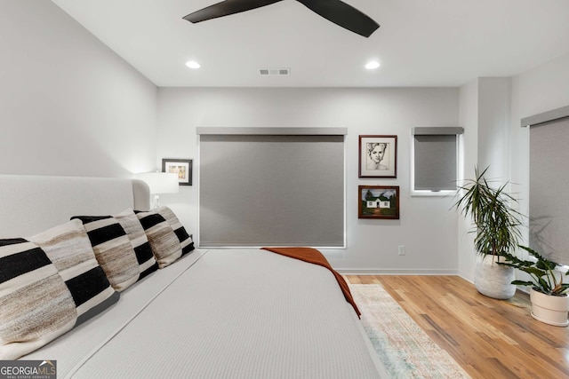 bedroom featuring visible vents, recessed lighting, a ceiling fan, and wood finished floors