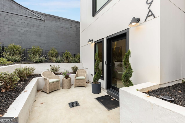 view of patio featuring fence and visible vents