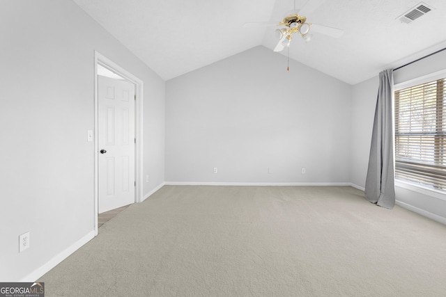 1484 Highland Bluff Ct, Suwanee, GA 30024 - empty room with visible vents, baseboards, a ceiling fan, lofted ceiling, and light colored carpet