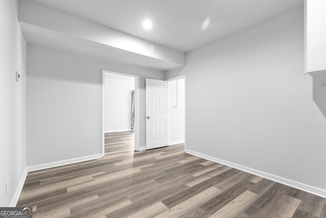 1484 Highland Bluff Ct, Suwanee, GA 30024 - unfurnished room with baseboards, wood finished floors, and recessed lighting