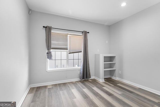 1484 Highland Bluff Ct, Suwanee, GA 30024 - empty room with recessed lighting, baseboards, and wood finished floors